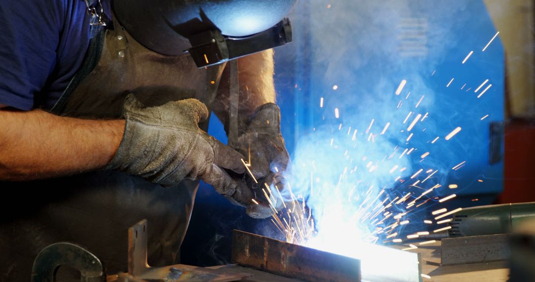 Welder Working With Steel, Creating Metal Sparks - Free Images, Stock Photos and Pictures on Pikwizard.com