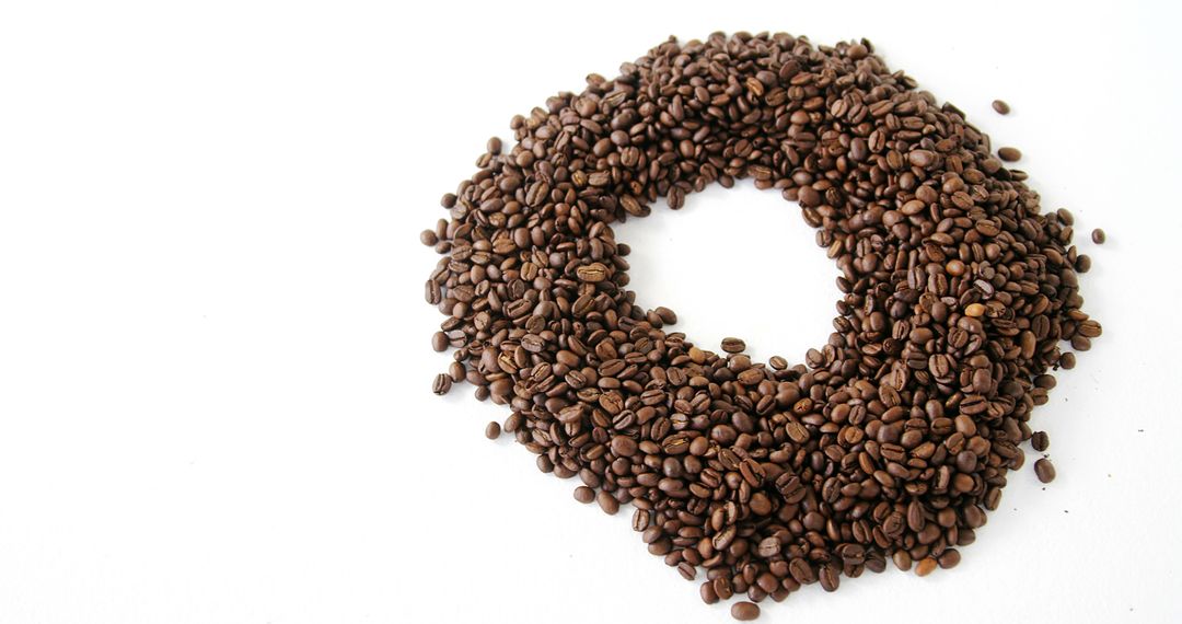 Circular Arrangement of Roasted Coffee Beans on White Background - Free Images, Stock Photos and Pictures on Pikwizard.com