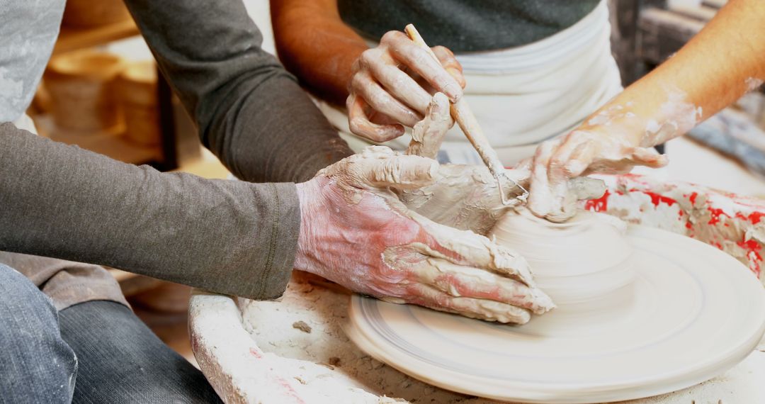 Hands Creating Pottery on Wheel in Artisan Studio - Free Images, Stock Photos and Pictures on Pikwizard.com