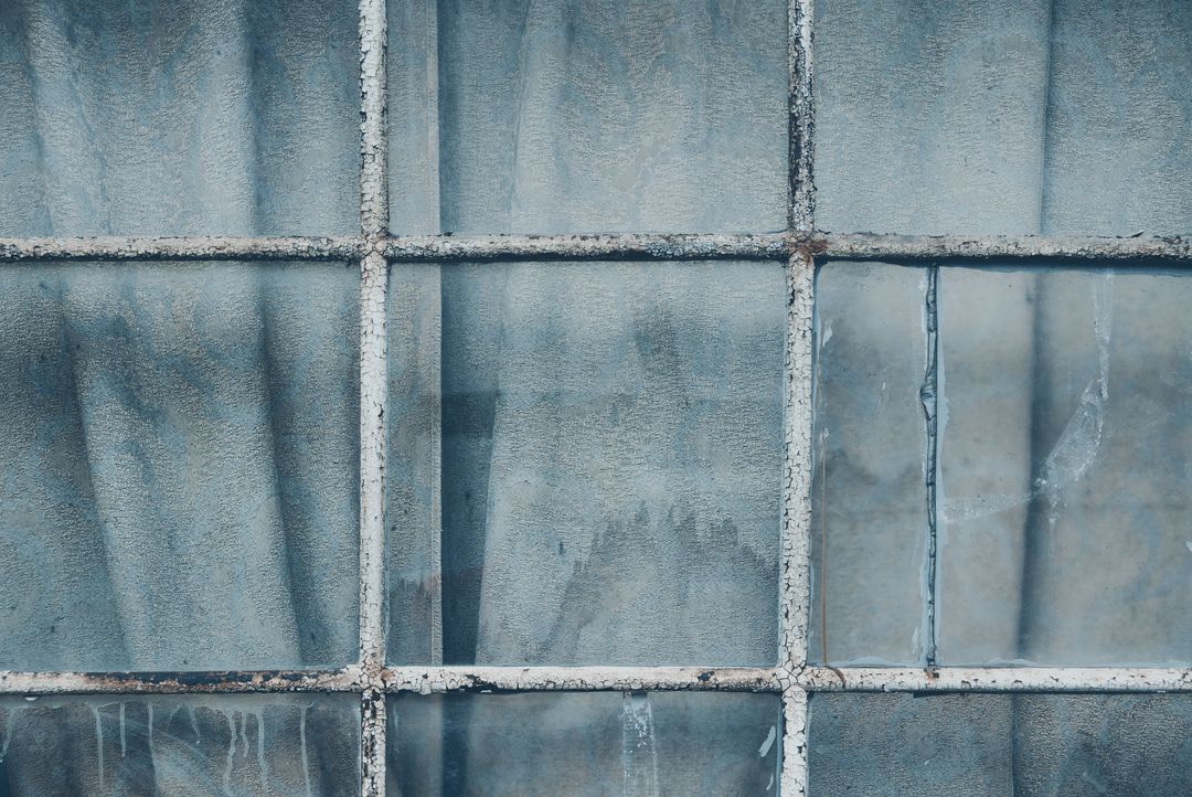 Old Weathered Window with Nine Panes and Peeling Paint
