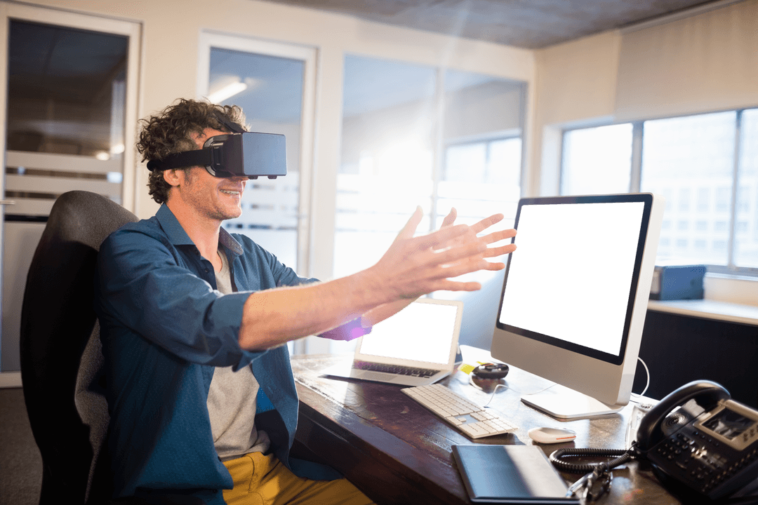 Man with Virtual Reality Glasses Working on Computer in Office