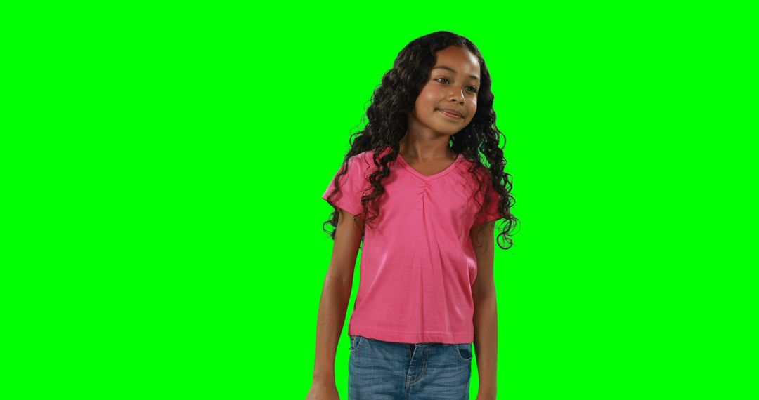 Confident Girl Posing in Front of Green Screen Background - Free Images, Stock Photos and Pictures on Pikwizard.com