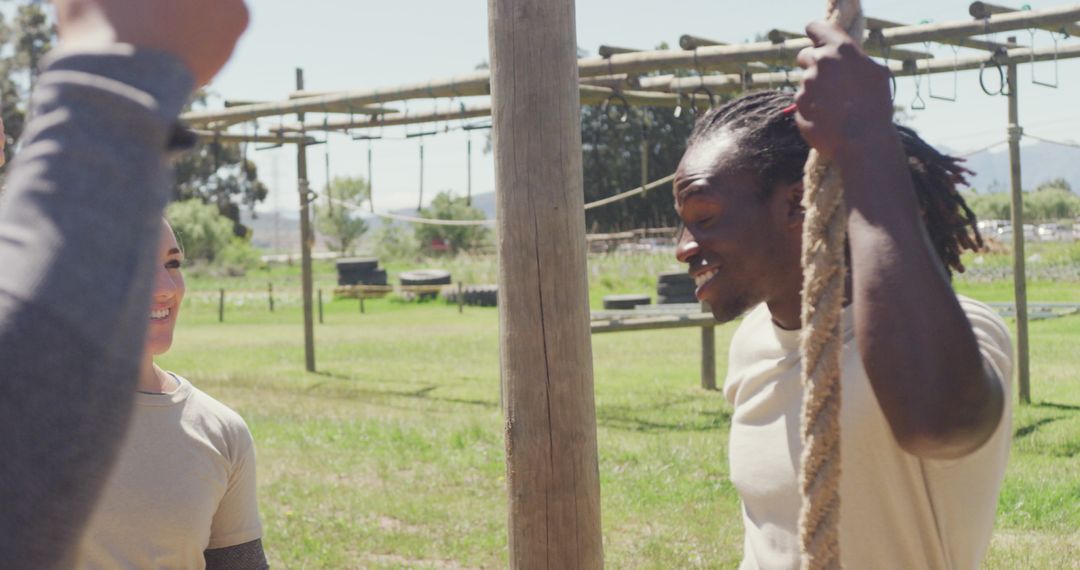 Soldiers Bonding During Break on Obstacle Course Outdoors