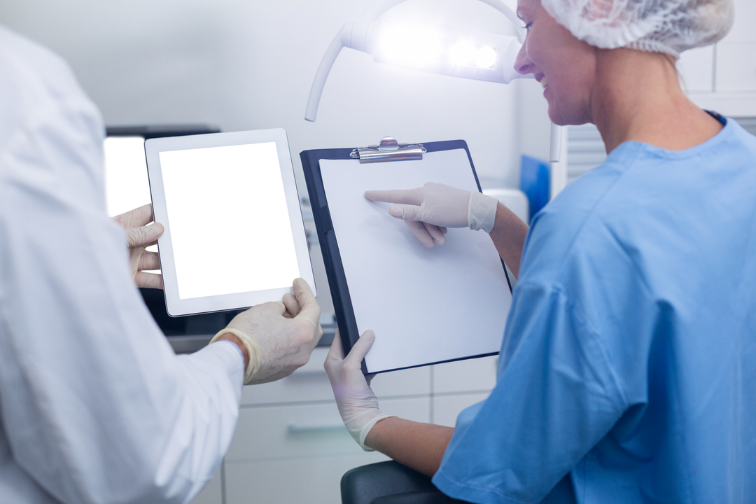 Dental Professionals Collaborating with Tablet in Modern Clinic - Download Free Stock Images Pikwizard.com