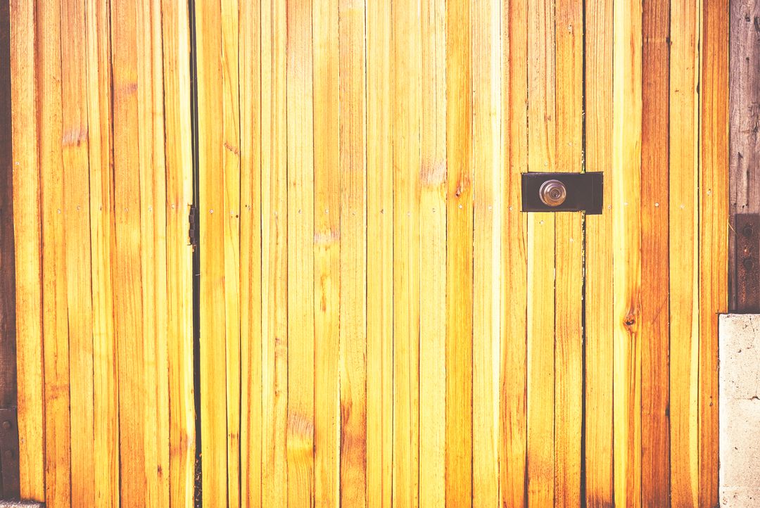 Radiant Wooden Door with Weathered Lock in Sunlight