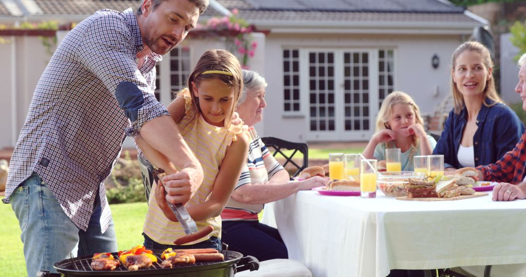 Family Gathering with Outdoor Barbecue in Garden - Free Images, Stock Photos and Pictures on Pikwizard.com