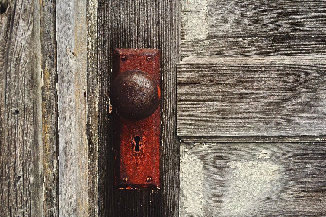 Weathered Wooden Door with Rusty Doorknob and Keyhole - Free Images, Stock Photos and Pictures on Pikwizard.com