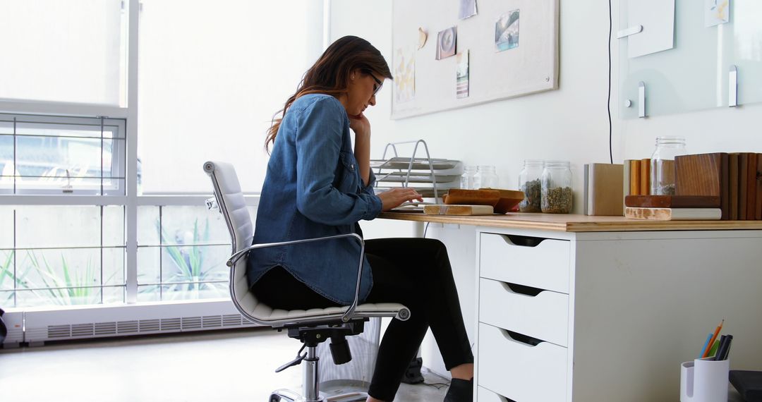 Woman Working at Home Office Desk with Laptop - Free Images, Stock Photos and Pictures on Pikwizard.com