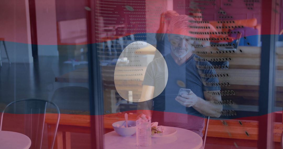 Senior Man Enjoying Lunch in Modern Coffee Shop Environment