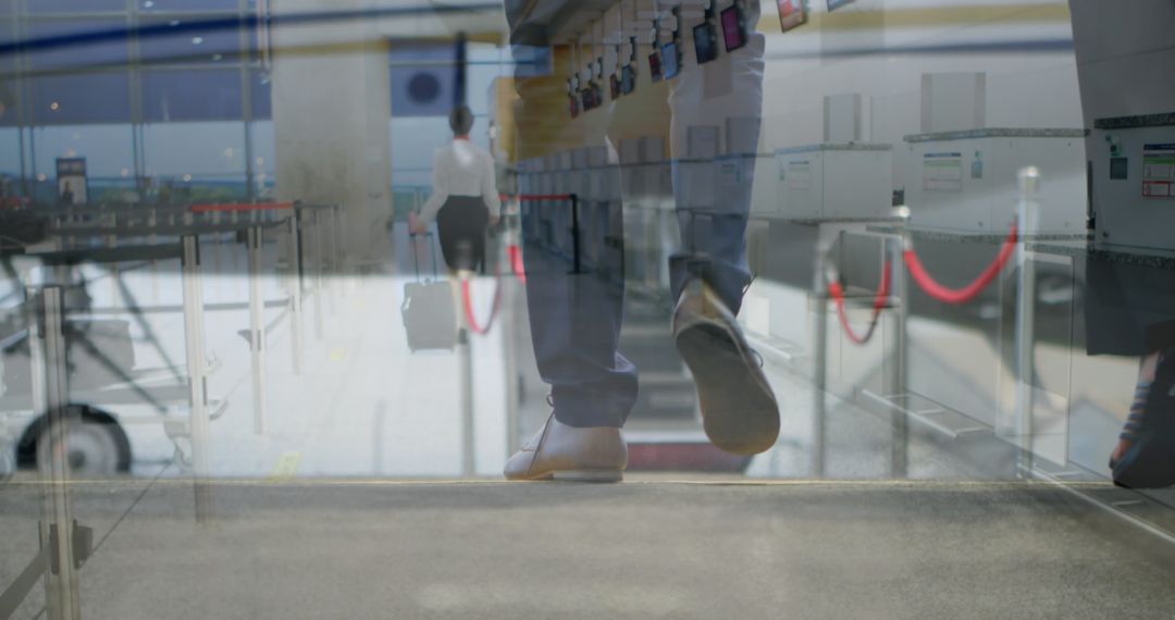 Traveler Walking Through Airport Check-In with Suitcase