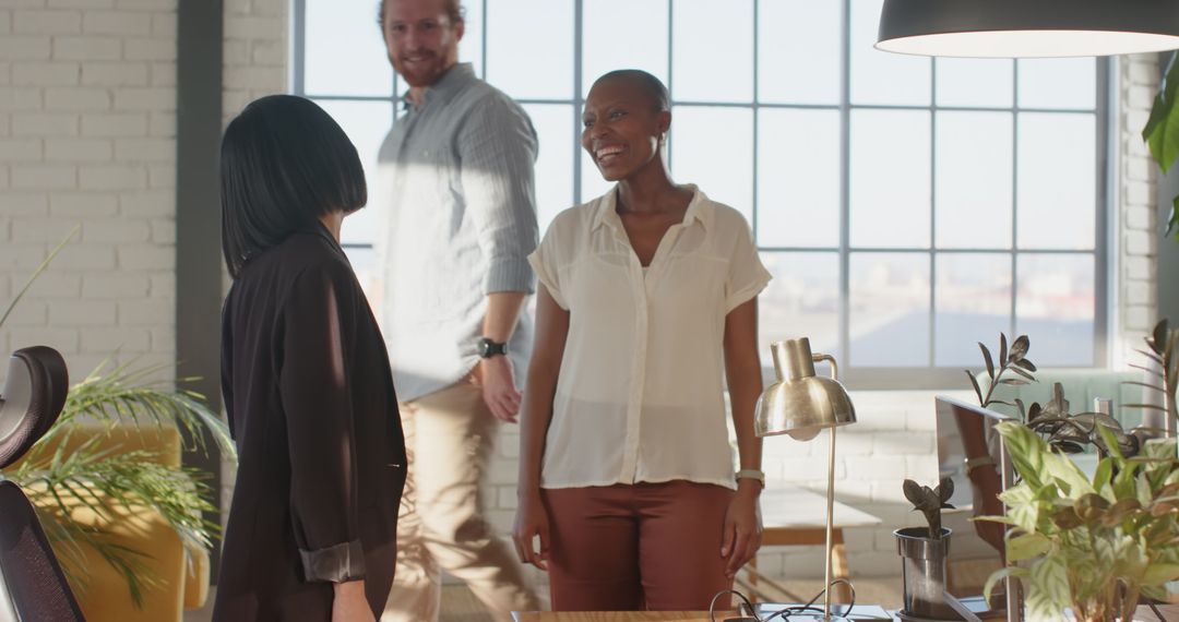 Multiracial Team Collaborating Happily in Bright Office Space