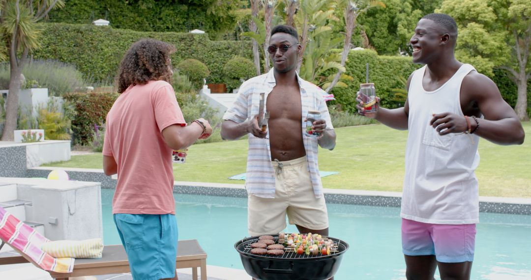 Friends Enjoying Outdoor Barbecue by Pool in Summer