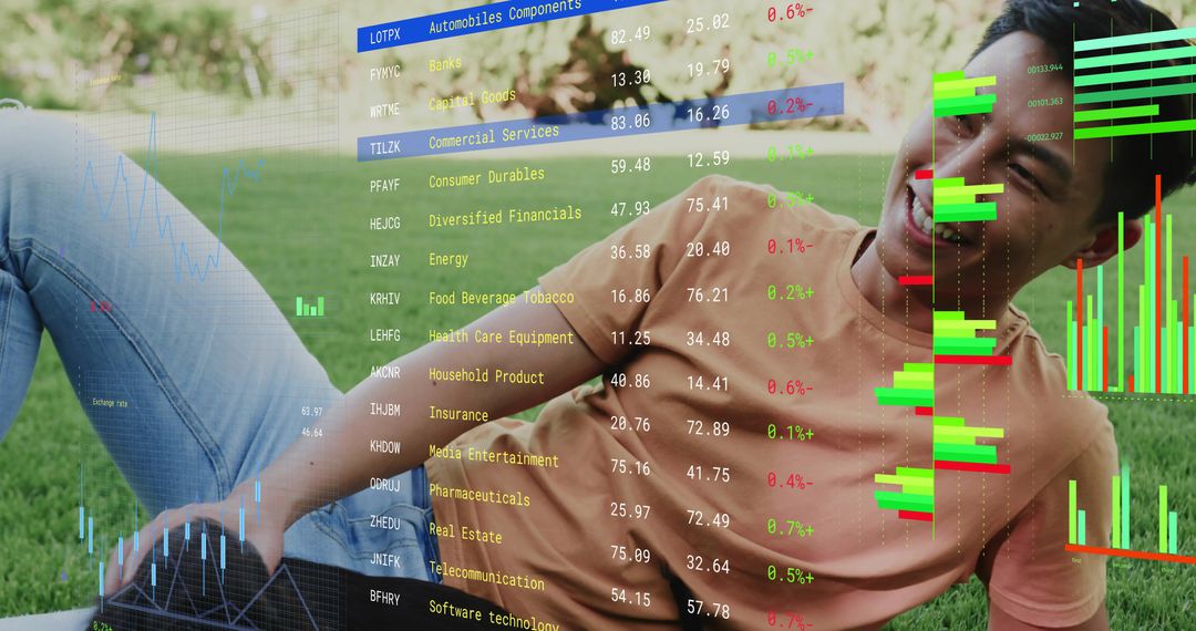 Young man reclining on lawn using laptop with overlaid stock market charts and analytics