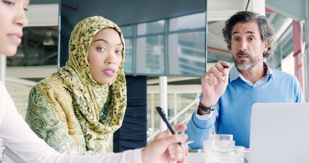 Culturally Diverse Team in Office Meeting - Free Images, Stock Photos and Pictures on Pikwizard.com