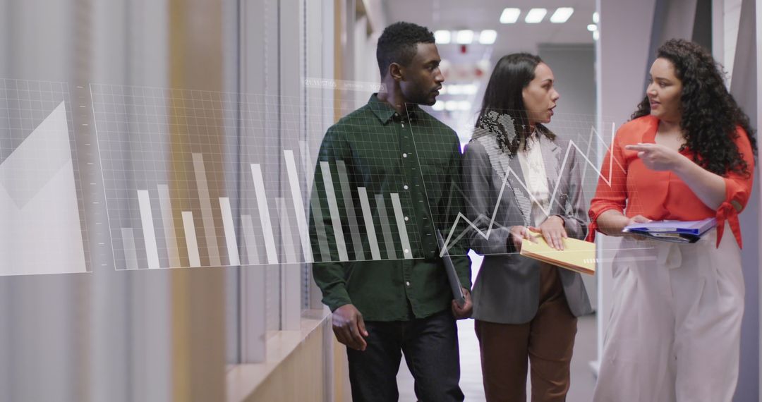 Diverse Colleagues Analyzing Data in Office Corridor