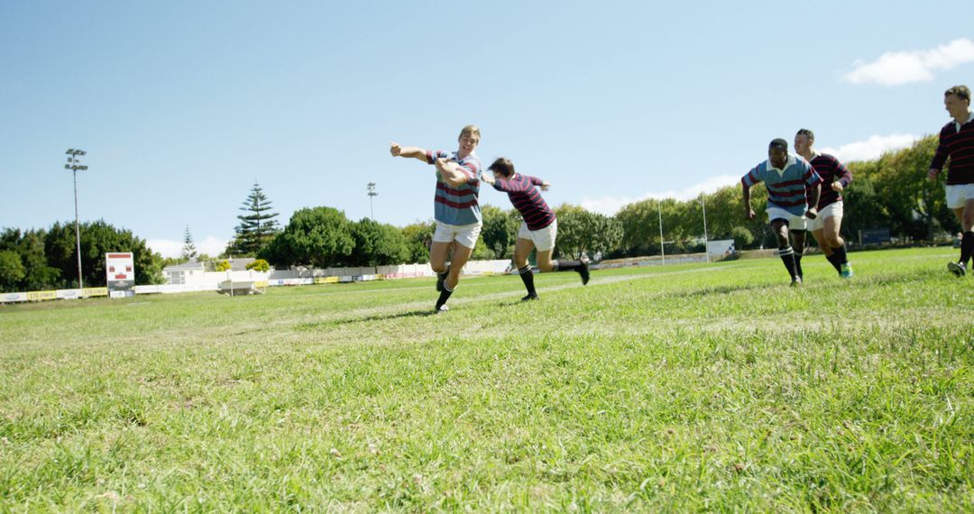 High School Rugby Players Competing on Field under Clear Sky - Free Images, Stock Photos and Pictures on Pikwizard.com