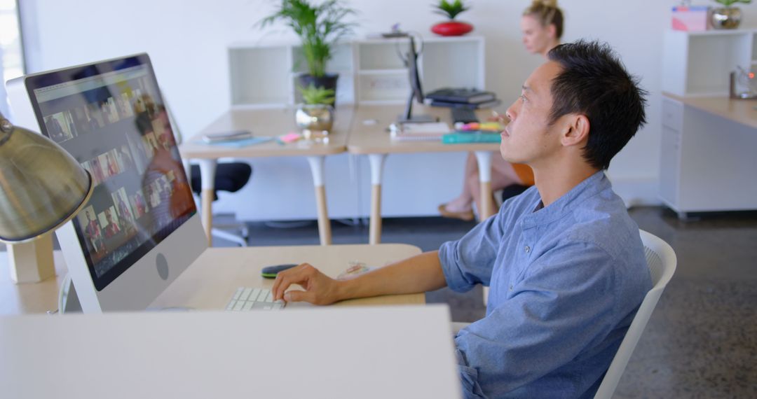 Focused Business Executive Working on Computer in Modern Office