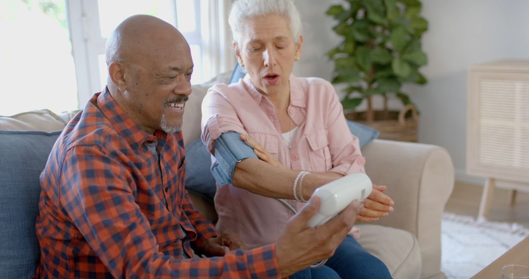 Senior Couple Using Blood Pressure Monitor at Home - Free Images, Stock Photos and Pictures on Pikwizard.com