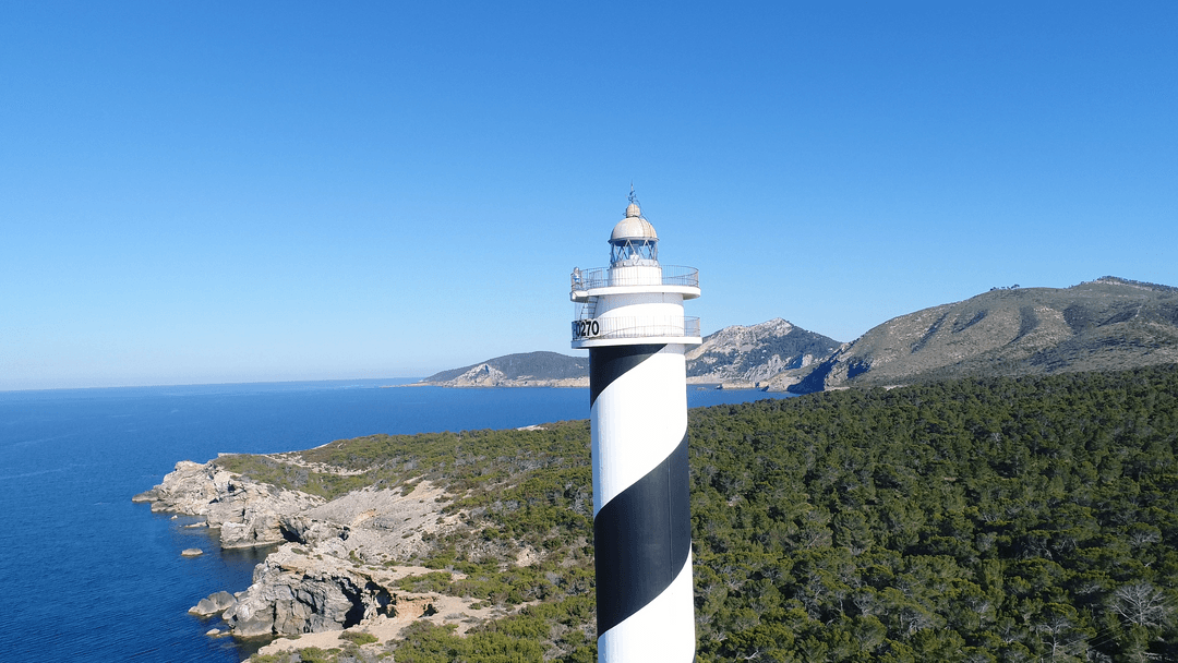 Transparent Coastal Lighthouse Overlooking Scenic Seascape