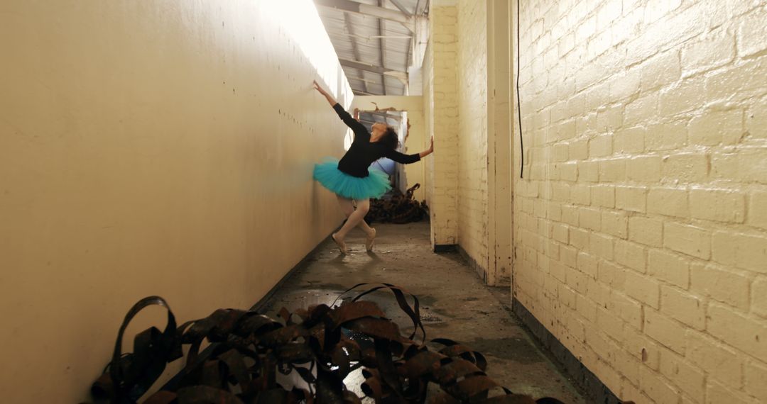 Ballet Dancer Practicing in Abandoned Corridor - Free Images, Stock Photos and Pictures on Pikwizard.com