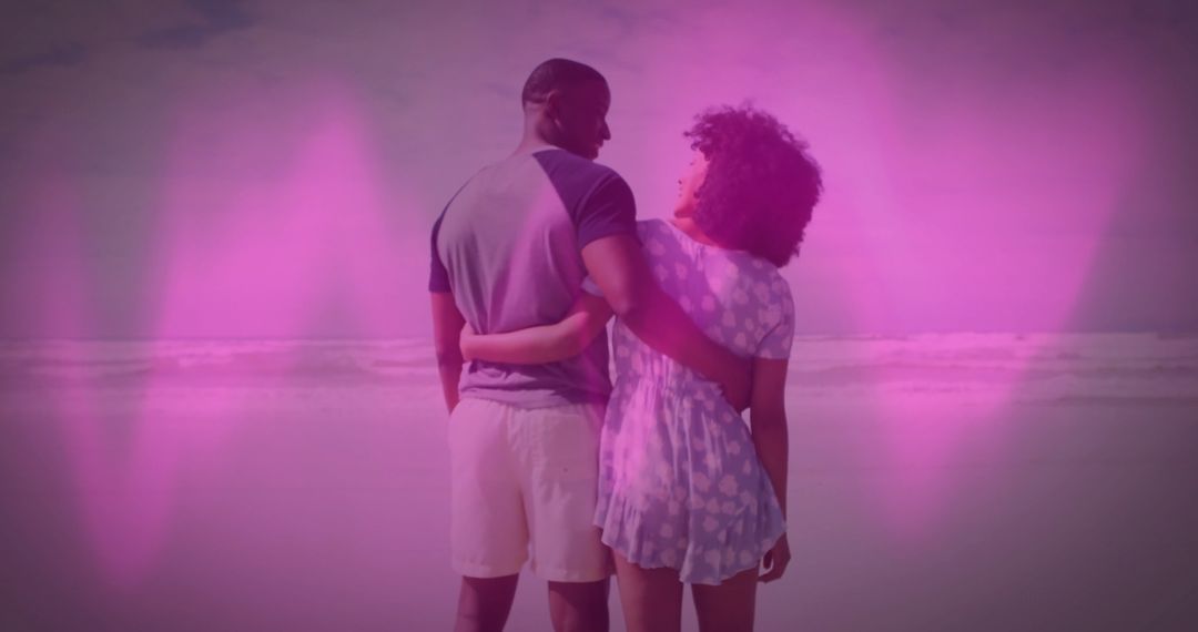 Couple Embracing at Ocean with Pink Heart Overlays