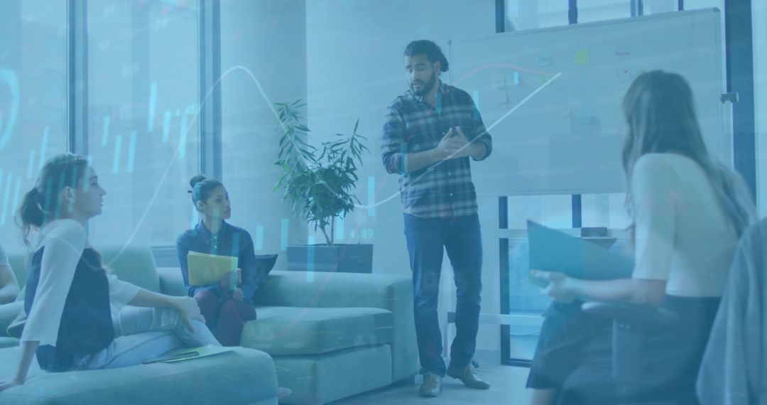 Diverse Team Discussing Data Visualization and Business Strategy in Office