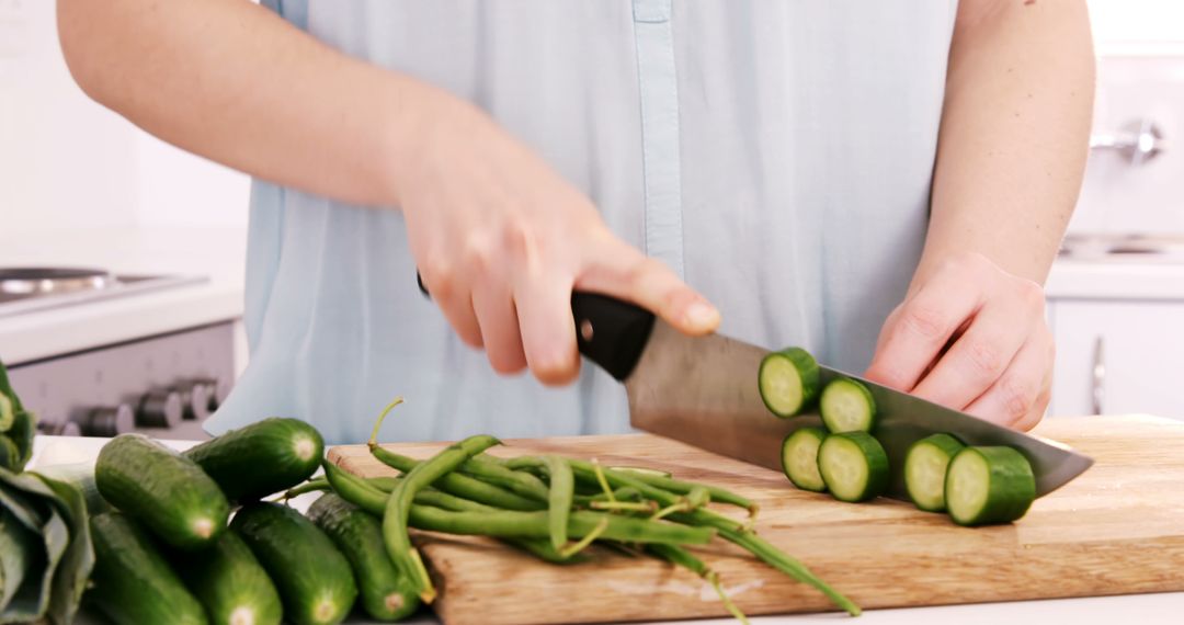 Person Slicing Fresh Vegetables in Kitchen - Free Images, Stock Photos and Pictures on Pikwizard.com