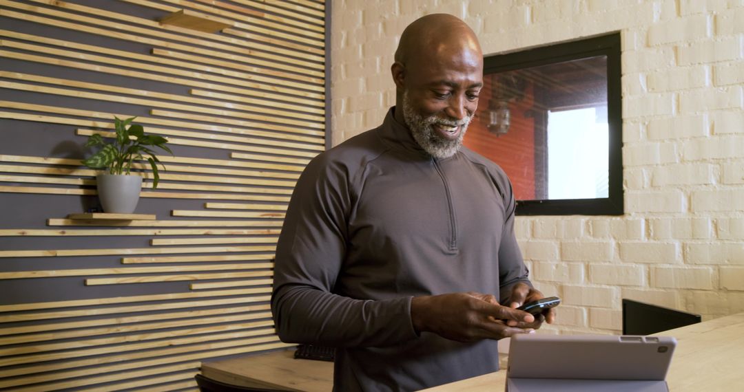 Confident Executive Multitasking in Modern Office Setting