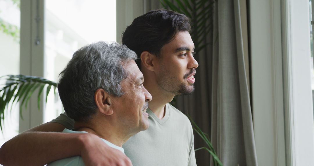 Senior Father and Adult Son Looking Through Window with Smiles - Free Images, Stock Photos and Pictures on Pikwizard.com