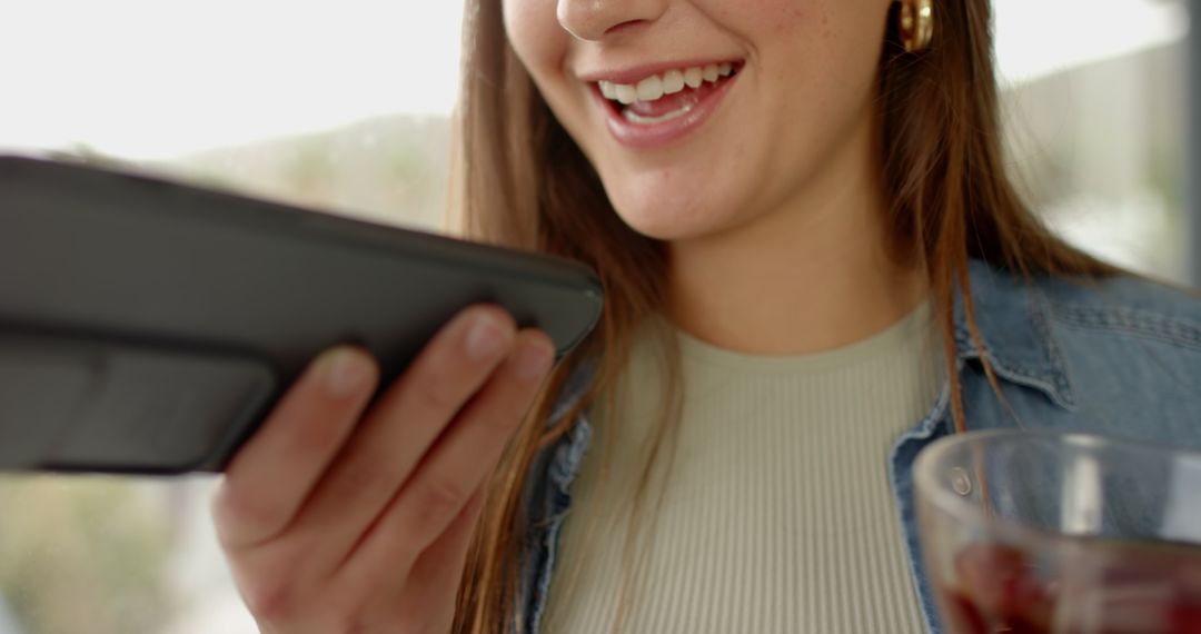 Happy Woman Using Tablet for Communication at Home