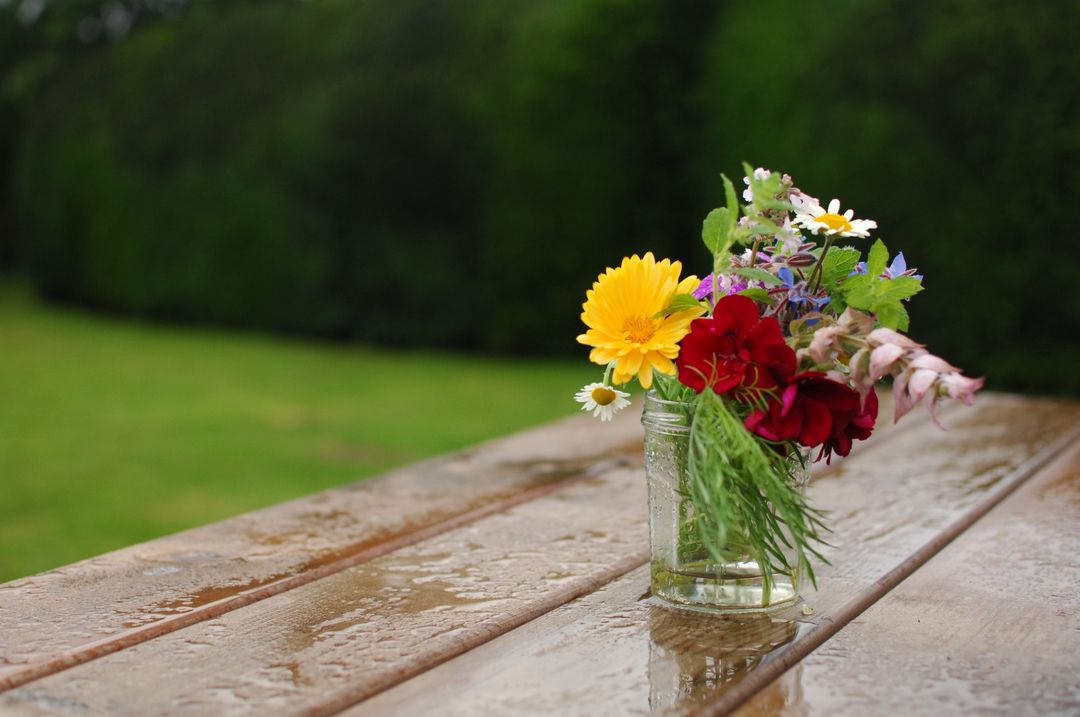 Rustic Bouquet in Glass Jar on Wooden Table