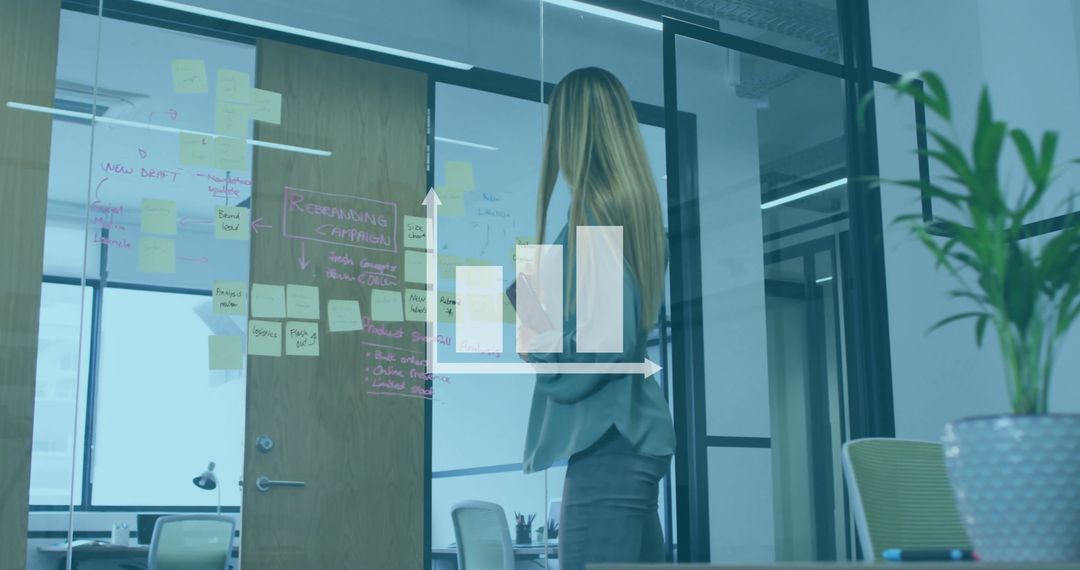 Businesswoman Visualizing Data Insights in Modern Office Setting