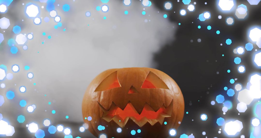 Glowing carved jack-o'-lantern casting warm light with fog and cyan hexagonal bokeh
