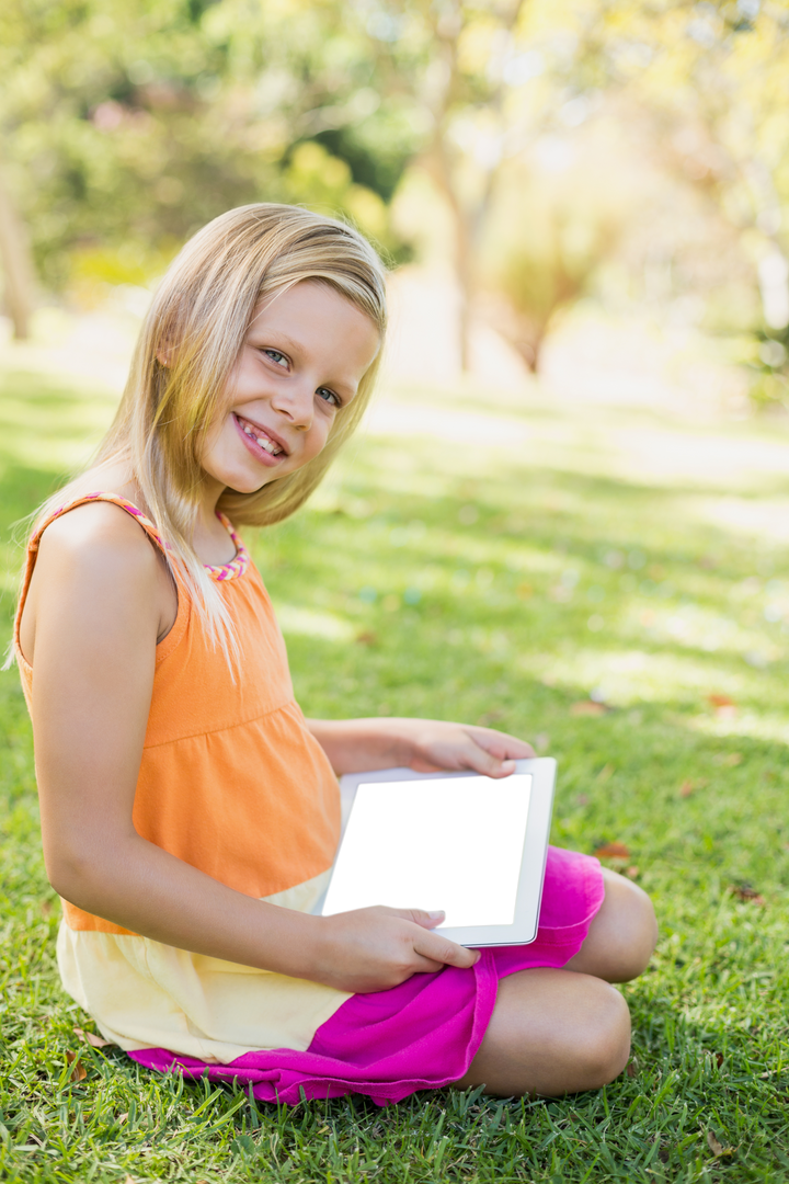 Smiling blonde girl holding transparent tablet screen outdoors - Download Free Stock Images Pikwizard.com