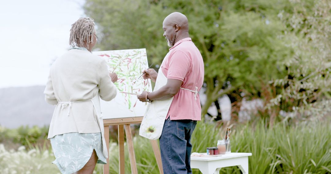 Senior Couple Painting on Easel Outdoors on Sunny Day - Free Images, Stock Photos and Pictures on Pikwizard.com