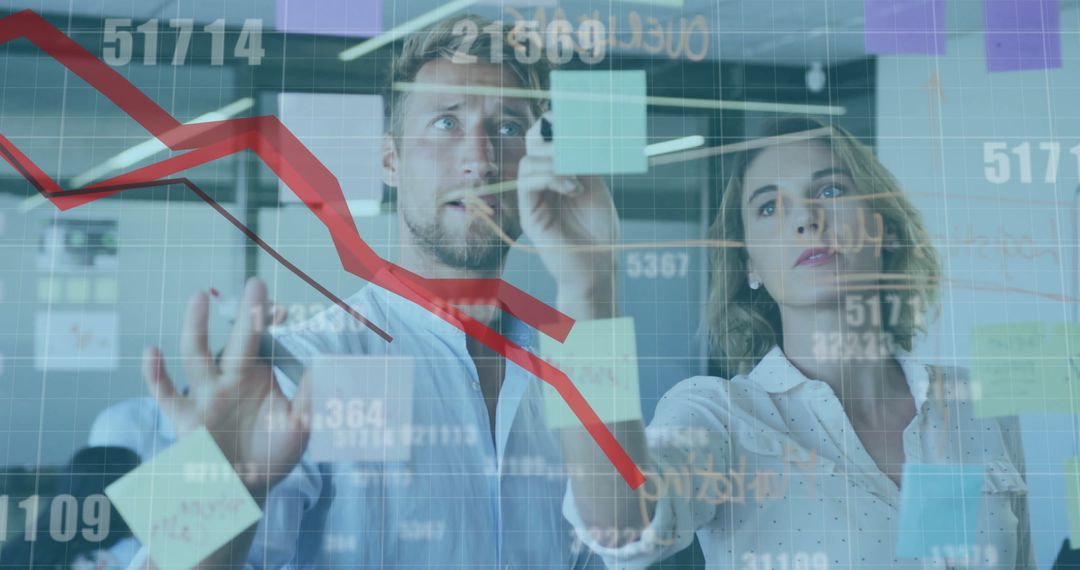 Business Team Analyzing Data Trends and Financial Graphs