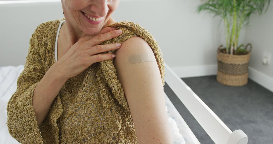 Woman smiling after getting vaccinated at home - Free Images, Stock Photos and Pictures on Pikwizard.com