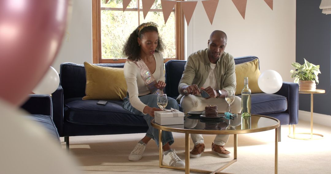 Diverse Couple Celebrating with Cake and Wine at Home