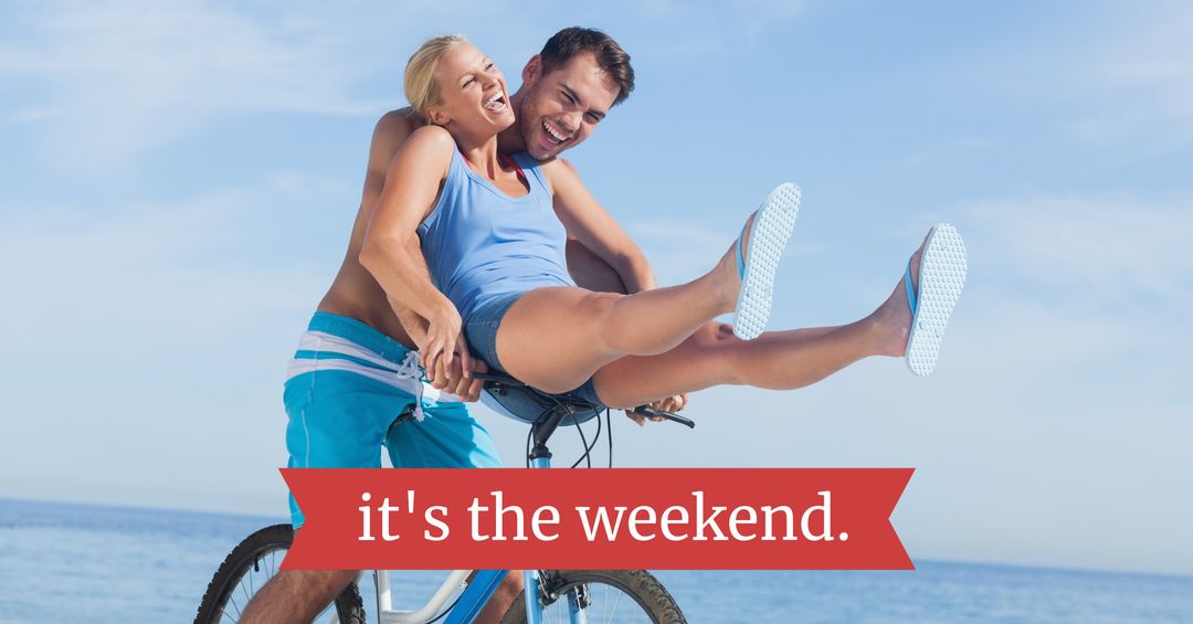 Joyful Couple Enjoying Bike Ride by the Ocean