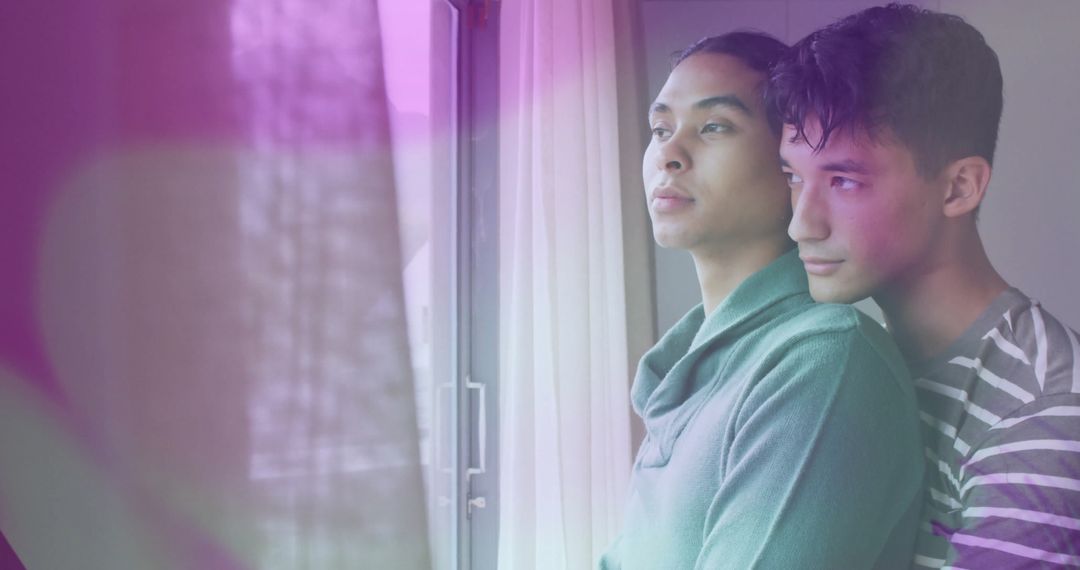 Loving Couple Embracing Near Modern Window with Soft Light