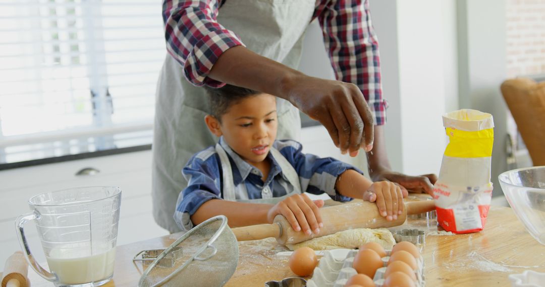 Child Learning to Bake with Father in Kitchen - Free Images, Stock Photos and Pictures on Pikwizard.com