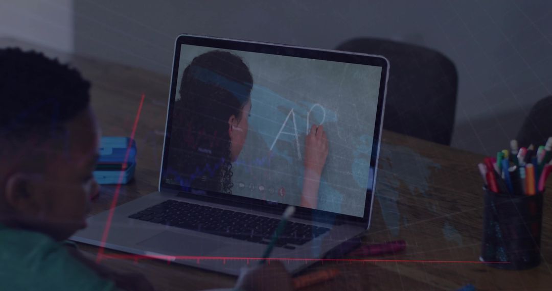 Child Learning Online with Educational Video on Laptop