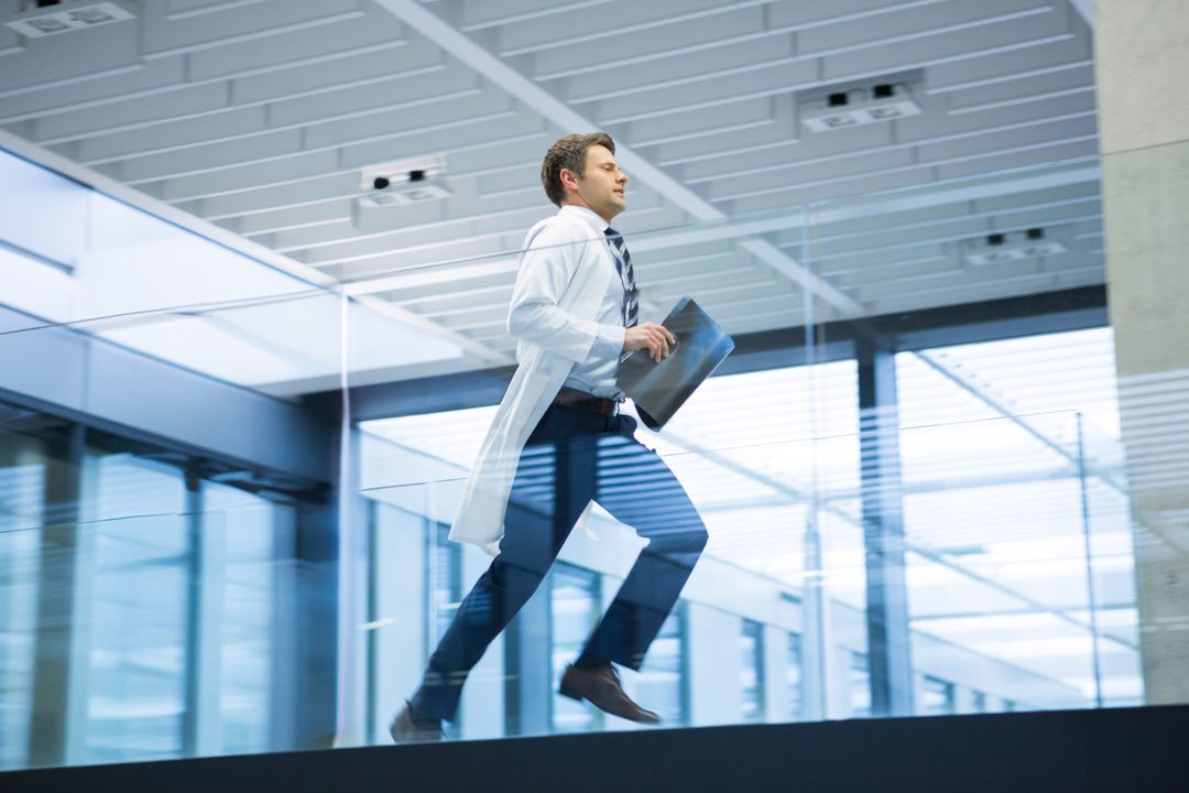 Efficient Professional with Tablet in Modern Medical Facility