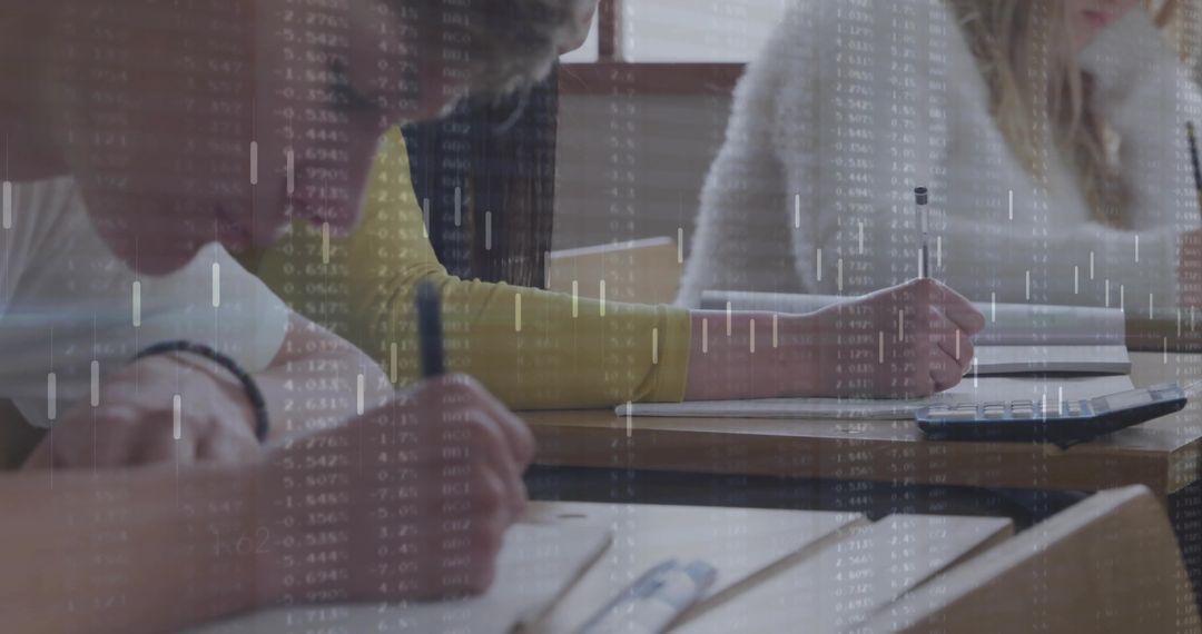 Focused Students Writing in Classroom with Overlaying Data