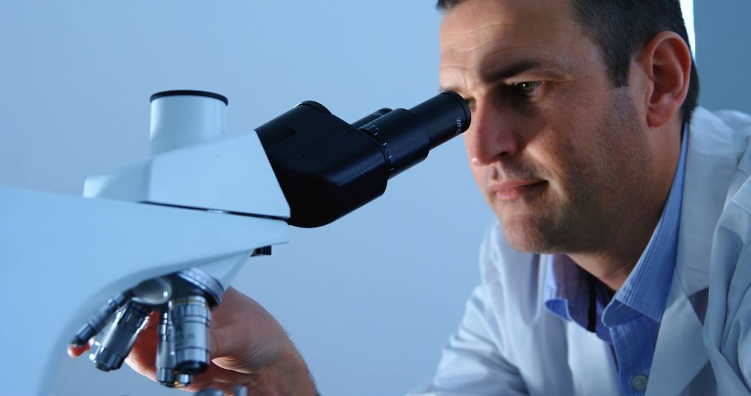 Male Scientist using Microscope for Laboratory Research - Free Images, Stock Photos and Pictures on Pikwizard.com