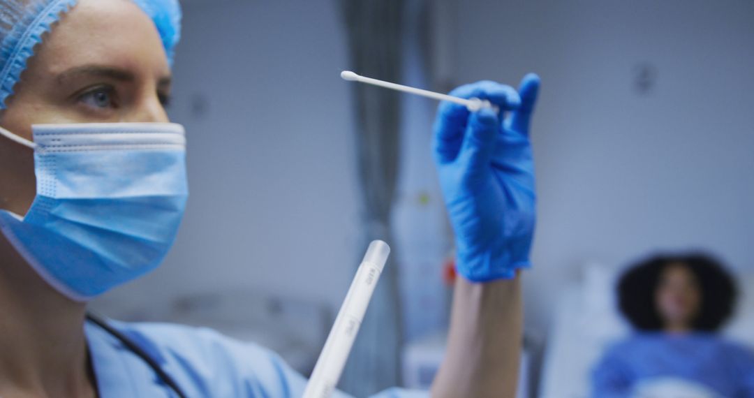 Healthcare Worker Holding a Medical Swab in a Hospital Room - Free Images, Stock Photos and Pictures on Pikwizard.com