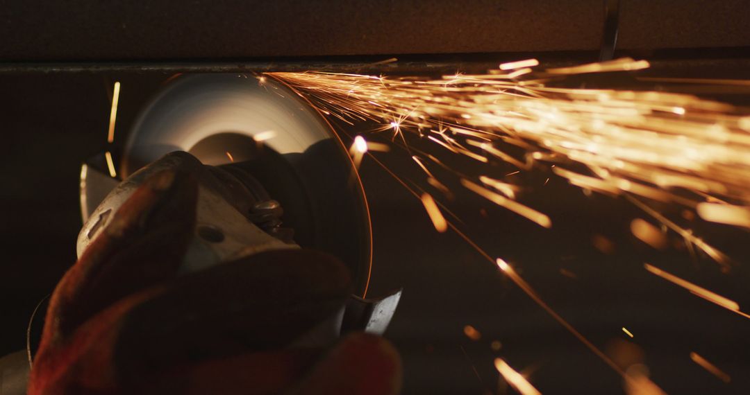 Worker Grinding Metal with an Angle Grinder Creating Sparks - Free Images, Stock Photos and Pictures on Pikwizard.com