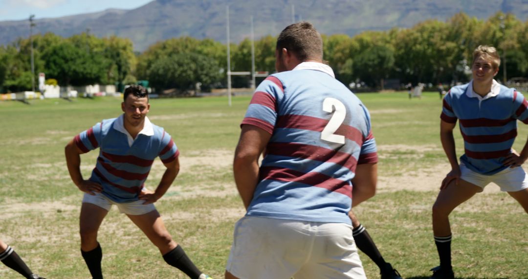 Rugby Team Engaging in Intense Training Session Under Clear Skies