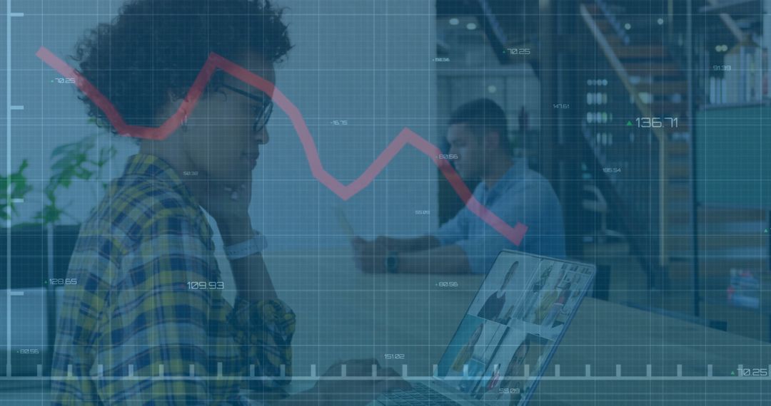Coworkers Analyzing Reports in Creative Office Environment