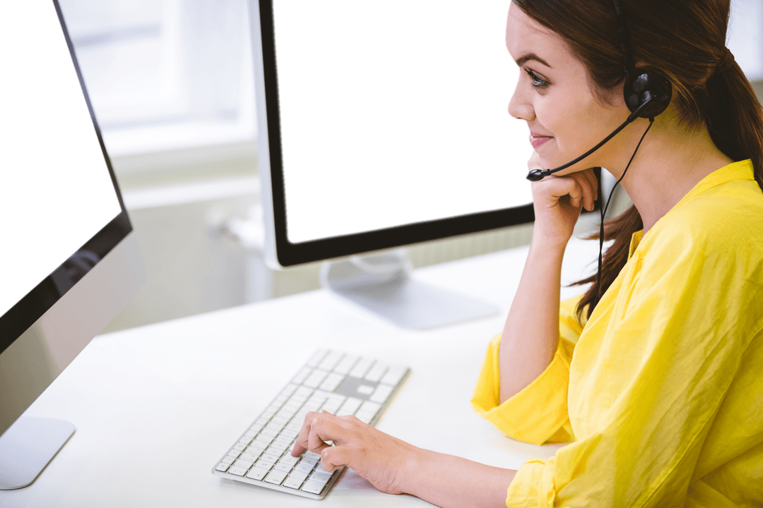 Woman Working on Desktop with Headset in Transparent Office Setting